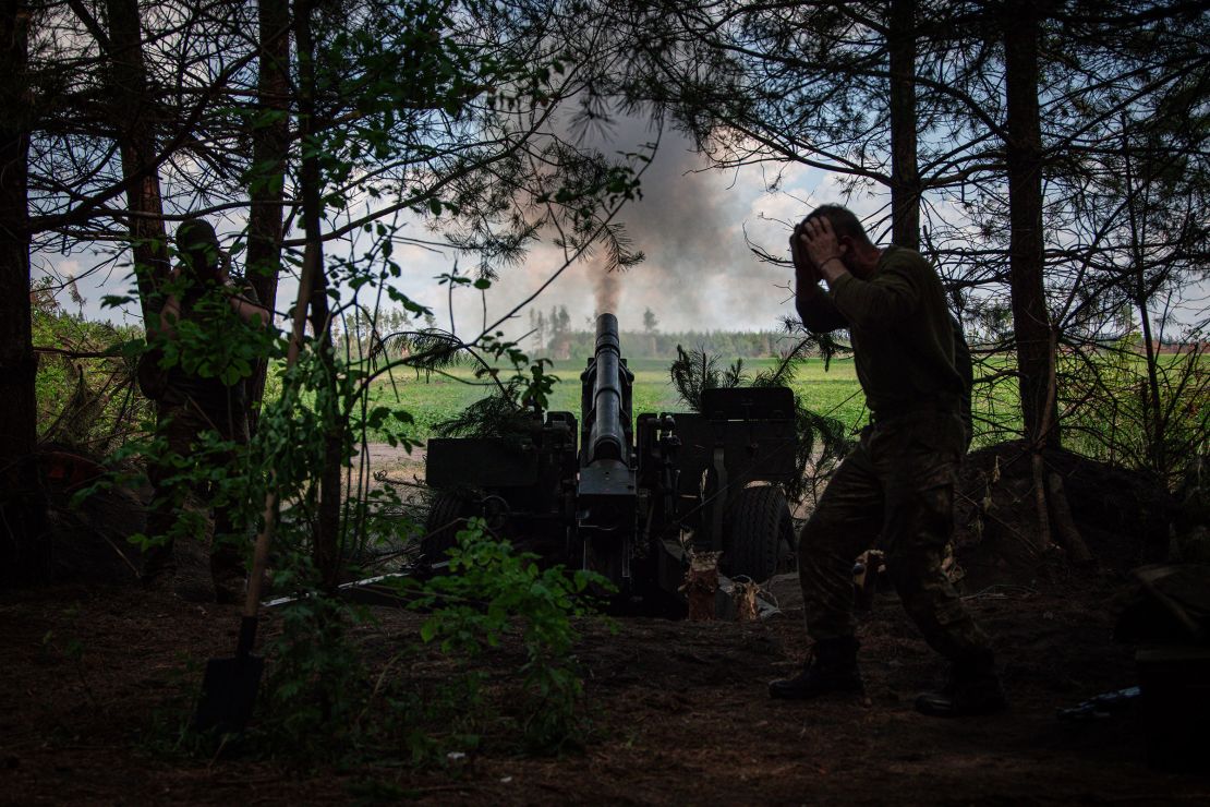 Ukrainian soldiers with the 57th Motorized Brigade operate at an artillery position on June 9, near Vovchansk in the Kharkiv Region of Ukraine.