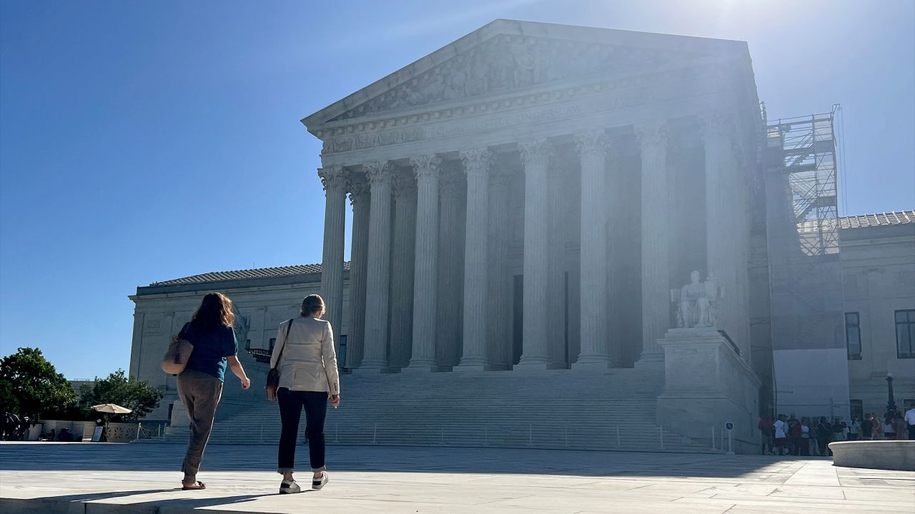 Visitors walk across the west plaza of the US Supreme Court on June 7, in Washington, DC.