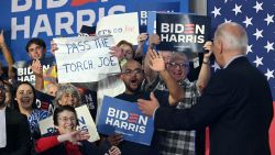 A person attending a rally for President Joe Biden holds a sign that read "Pass the torch Joe" during a campaign event in Madison, Wisconsin, on July 5.