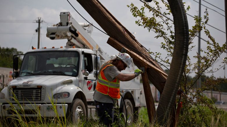 CenterPoint foreign assistance crews work to restore power lines on July 11, 2024 in Houston, Texas. 