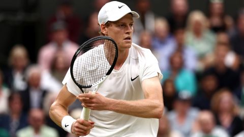 Jannik Sinner of Italy plays a backhand against Daniil Medvedev in the Gentlemen's Singles Quarter Final match during day nine of The Championships Wimbledon 2024 at All England Lawn Tennis and Croquet Club on July 09, 2024 in London, England.