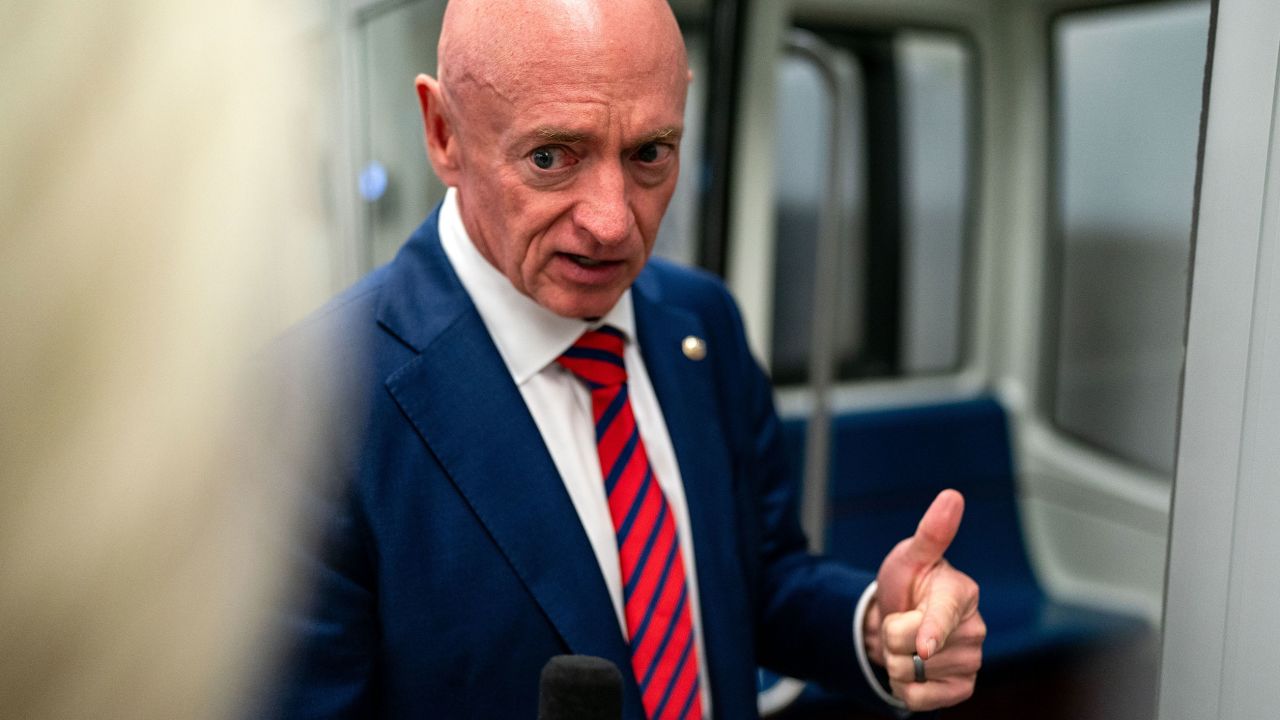 Sen. Mark Kelly rides the Senate subway to the Hart Senate Office Building from the U.S. Capitol on July 25 in Washington, DC.