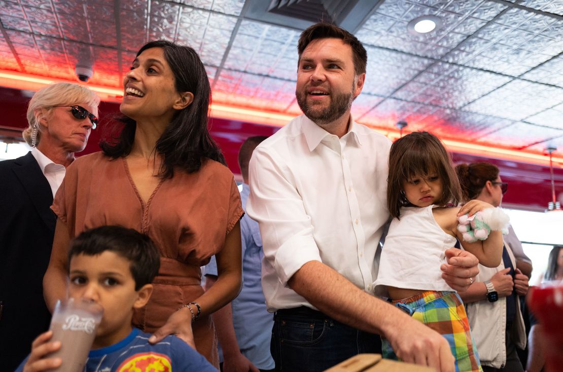 Usha and Sen. JD Vance with their kids greet supporters at the Park Diner on July 28, in St. Cloud, Minnesota. 