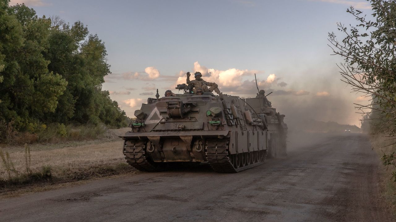 Ukrainian servicemen operate an armored military vehicle in the Sumy region near the border with Russia on August 12.