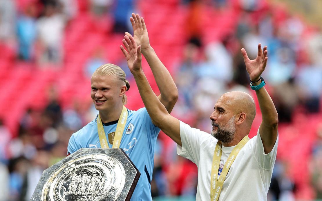 Erling Haaland and Pep Guardiola, Manager of Manchester City celebrate following the team's victory in the penalty shootout during the 2024 FA Community Shield match between Manchester United and Manchester City at Wembley Stadium on August 10, 2024 in London, England.