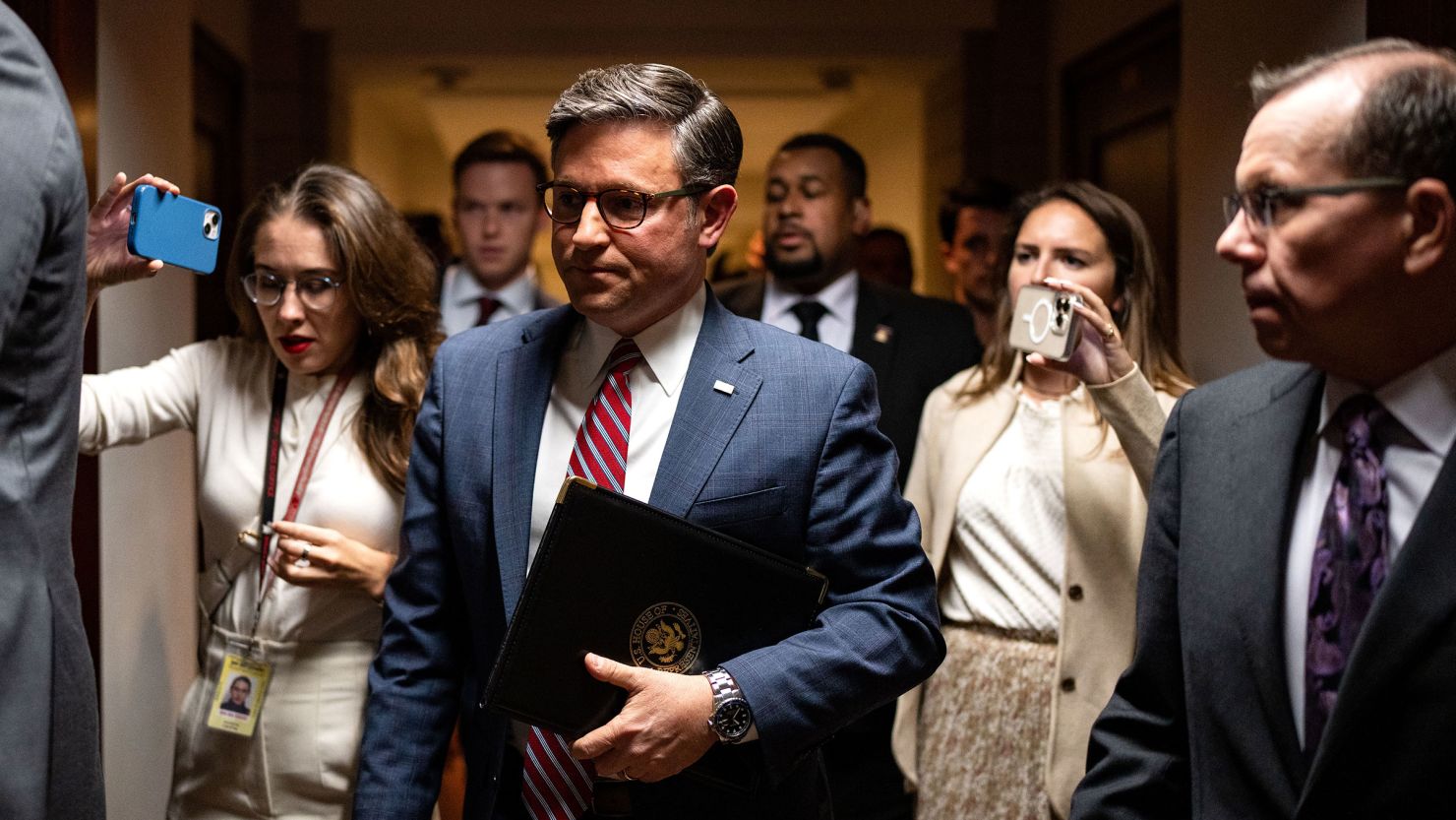 House Speaker Mike Johnson speaks with reporters as he departs a news conference at the US Capitol in Washington, DC, on September 10.