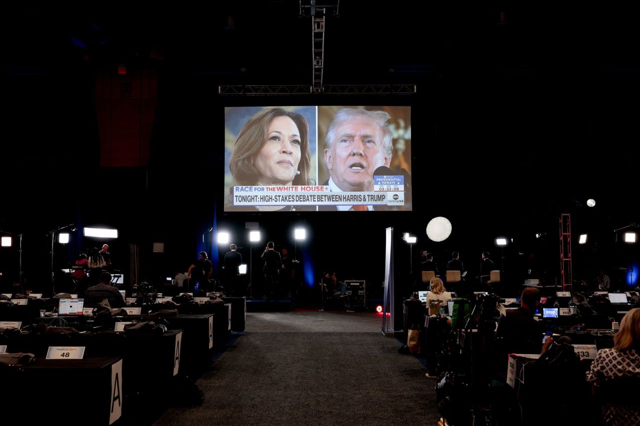 Vice President Kamala Harris and former President Donald Trump are seen on a screen at the Pennsylvania Convention Center in Philadelphia on September 10, ahead of their presidential debate.