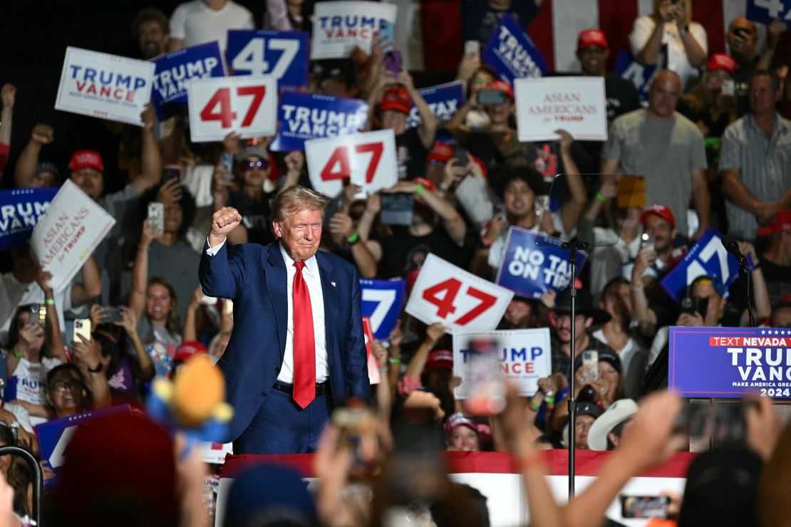 Donald Trump raises his fist on stage during a campaign rally at the Expo World Market Center on September 13, 2024 in Las Vegas, Nevada. 