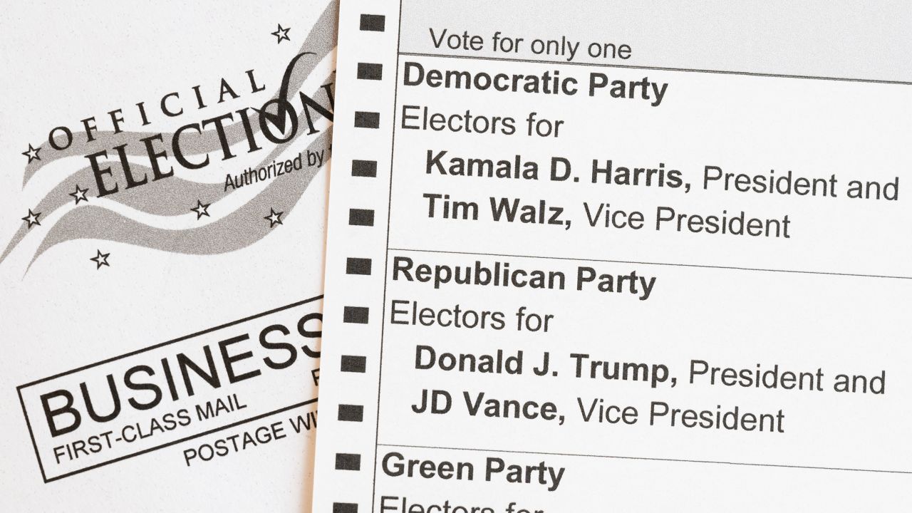 In this photo illustration, an absentee voter mail-in ballot shows the names of the presidential and vice presidential candidates for the November 5 US general election, including Democratic party candidates Vice President Kamala Harris and her running mate, Minnesota Governor Tim Walz, and Republican party candidate former President Donald Trump and his running mate, Ohio Senator JD Vance, on September 25, 2024 in Arlington, Virginia.