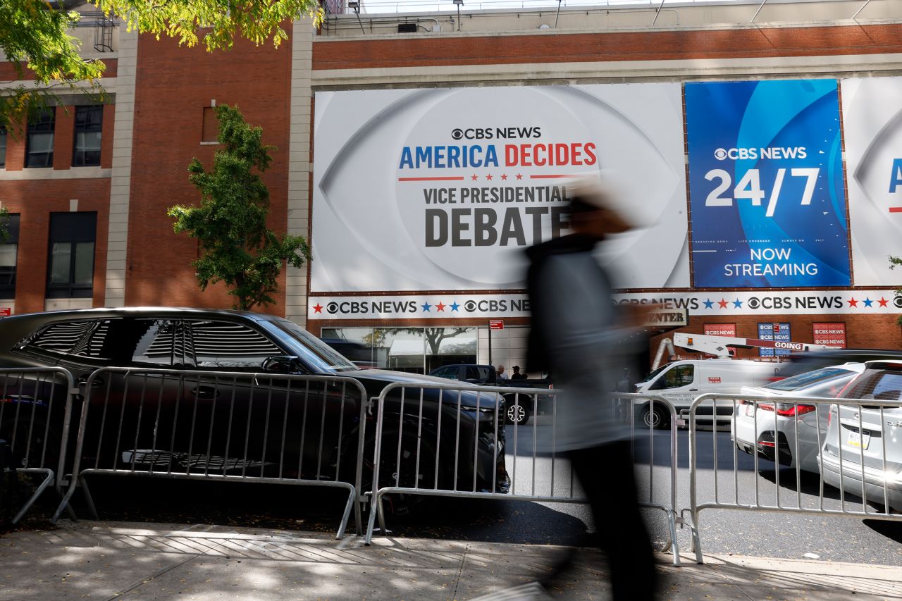 People walk past the CBS Broadcast Center the day before the television network will host the vice presidential debate on September 30, 2024 in New York City.