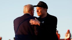 Elon Musk embraces former President Donald Trump during a campaign rally at the Butler Farm Show fairgrounds on October 5 in Butler, Pennsylvania.