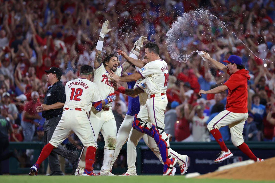 Nick Castellanos of the Philadelphia Phillies celebrates with teammates after the game-winning hit to defeat the New York Mets in Game Two of the Division Series at Citizens Bank Park on October 6 in Philadelphia.