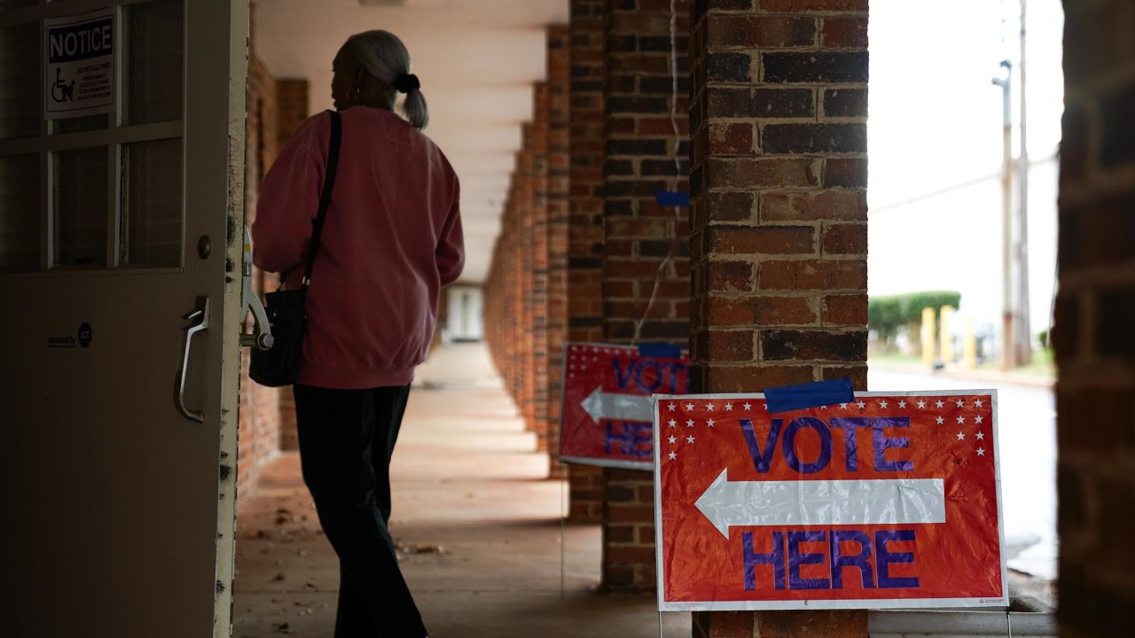 People arrive to cast their votes on the first day of early voting at East Point First Mallalieu United Methodist Church on October 15, 2024 in Atlanta.