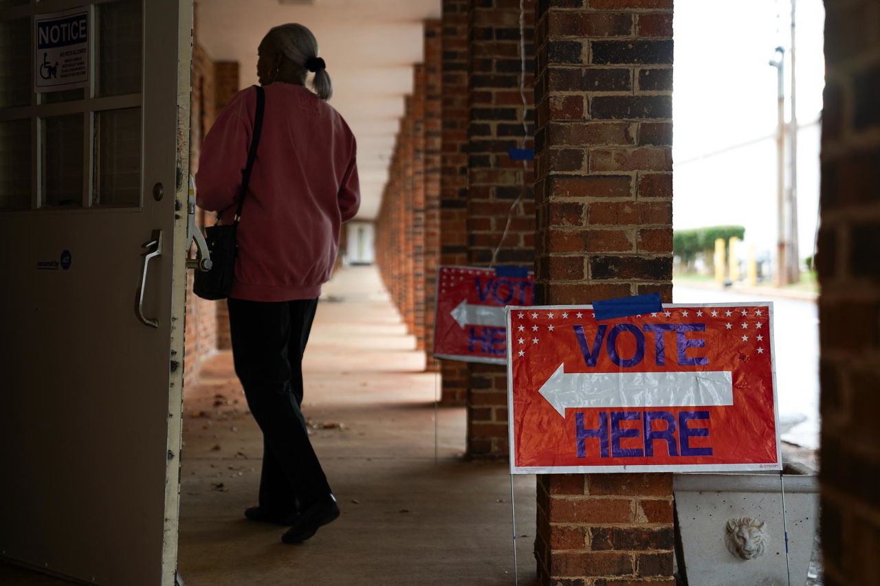 People arrive to cast their votes on the first day of early voting at East Point First Mallalieu United Methodist Church on October 15, 2024 in Atlanta. 