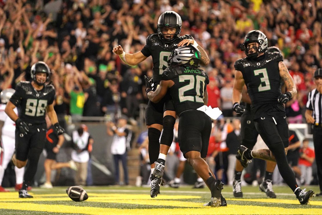 Dillon Gabriel of the Oregon Ducks celebrates with teammates during the second half against the Ohio State Buckeyes at Autzen Stadium on October 12, in Eugene, Oregon.