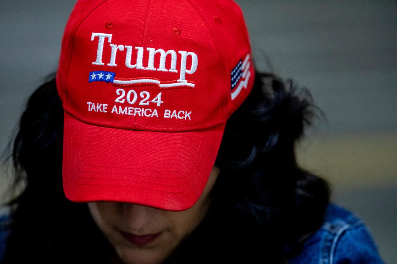 An attendee wears a hat supporting former President Donald Trump during a campaign event with Republican nominee for US Senate candidate Bernie Moreno on November 1 in at Spartan Northwood Warehouse in Northwood, Ohio. 