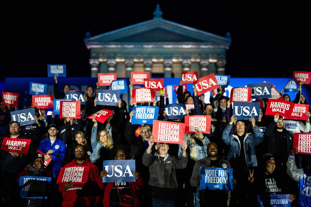 Audience members listen as Vice President Kamala Harris speaks during the closing rally of her campaign at the base of the iconic "Rocky Steps" at the Philadelphia Museum of Art on November 5 in Philadelphia.