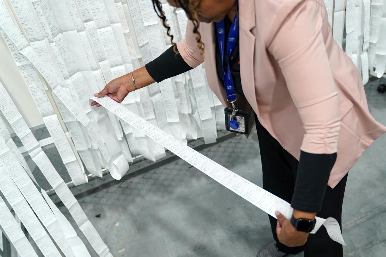 Receipts from early voting are brought out during election night on November 5 in Lawrenceville, Georgia. 