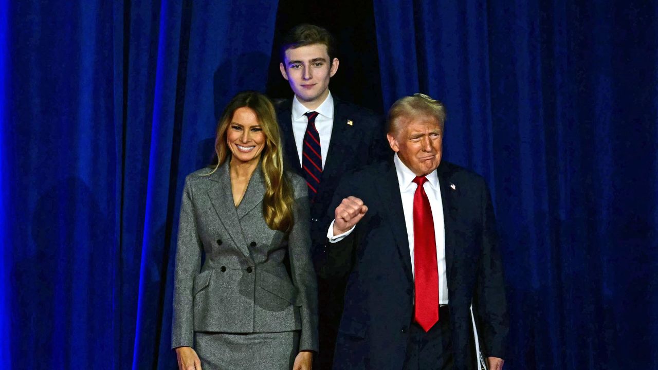 Former President Donald Trump arrives for an election night event alongside former First Lady Melania Trump and his son Barron Trump at the West Palm Beach Convention Center in West Palm Beach, Florida, on November 6.