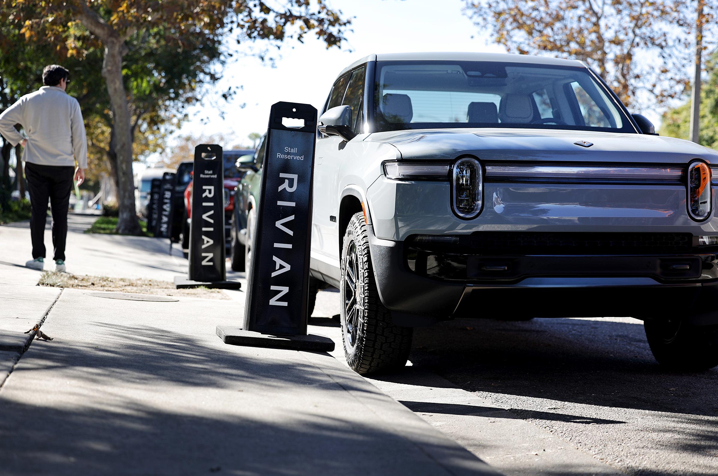 Rivian electric vehicles are parked at the Rivian Venice Hub on November 13, in Venice, California. 