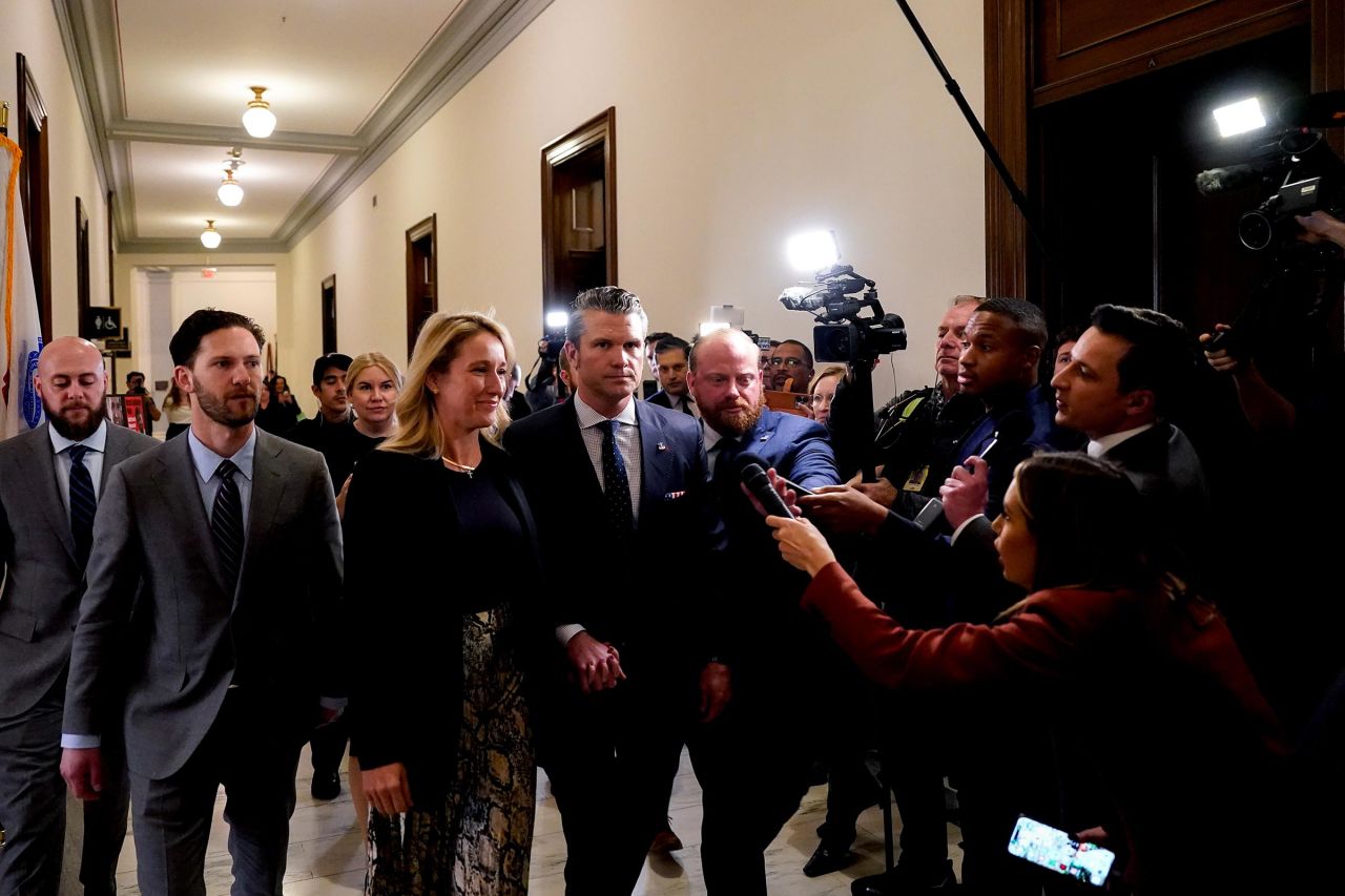 Pete Hegseth and his wife Jennifer Rauchet arrive for a meeting with Sen. Joni Ernst on Capitol Hill in Washington, DC, on Wednesday.