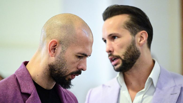 Andrew Tate, left, and his brother Tristan Tate are pictured inside The Court of Appeal in Bucharest, Romania, on December 10, 2024.