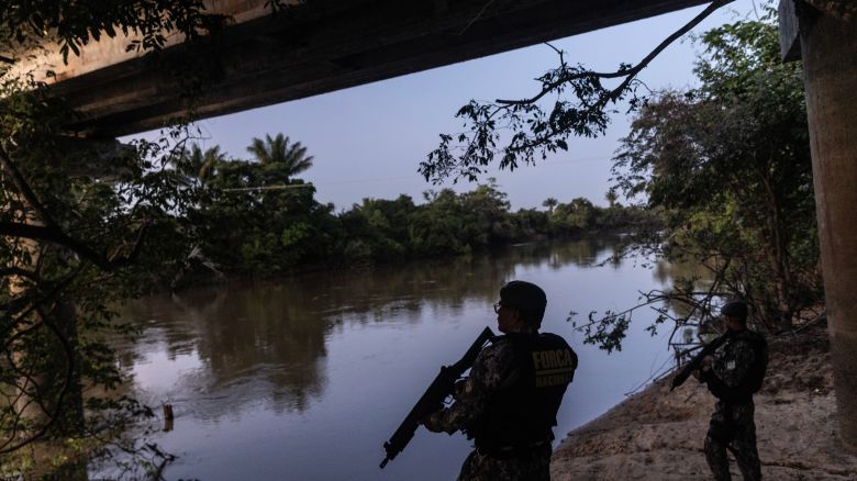 A police patrol performs a raid under a bridge on Mucajai river to curb illegal activity surrounding Yanomami territory in Roraima, Brazil, Thursday, September 19, 2024. The First Capital Command (PCC), South America's largest criminal organization, is expanding into the vast Amazon basin.
