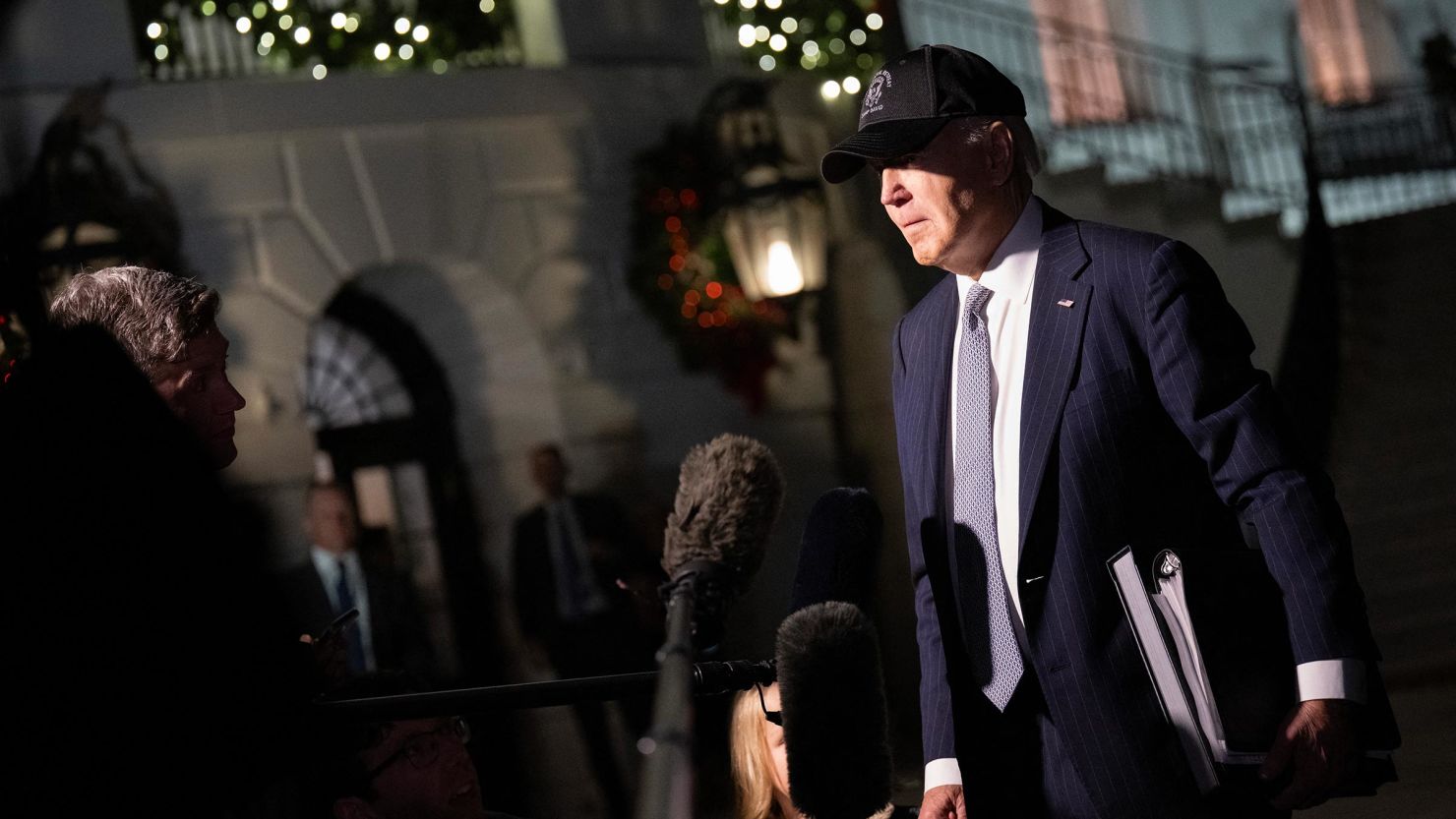 President Joe Biden speaks to reporters as he departs the White House enroute to Wilmington, Delaware, on December 17, in Washington, DC.