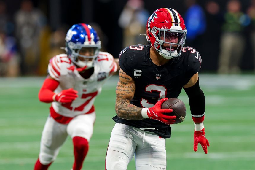 Jessie Bates III of the Atlanta Falcons returns an interception for a touchdown against the New York Giants during the second quarter at Mercedes-Benz Stadium on December 22, 2024 in Atlanta.