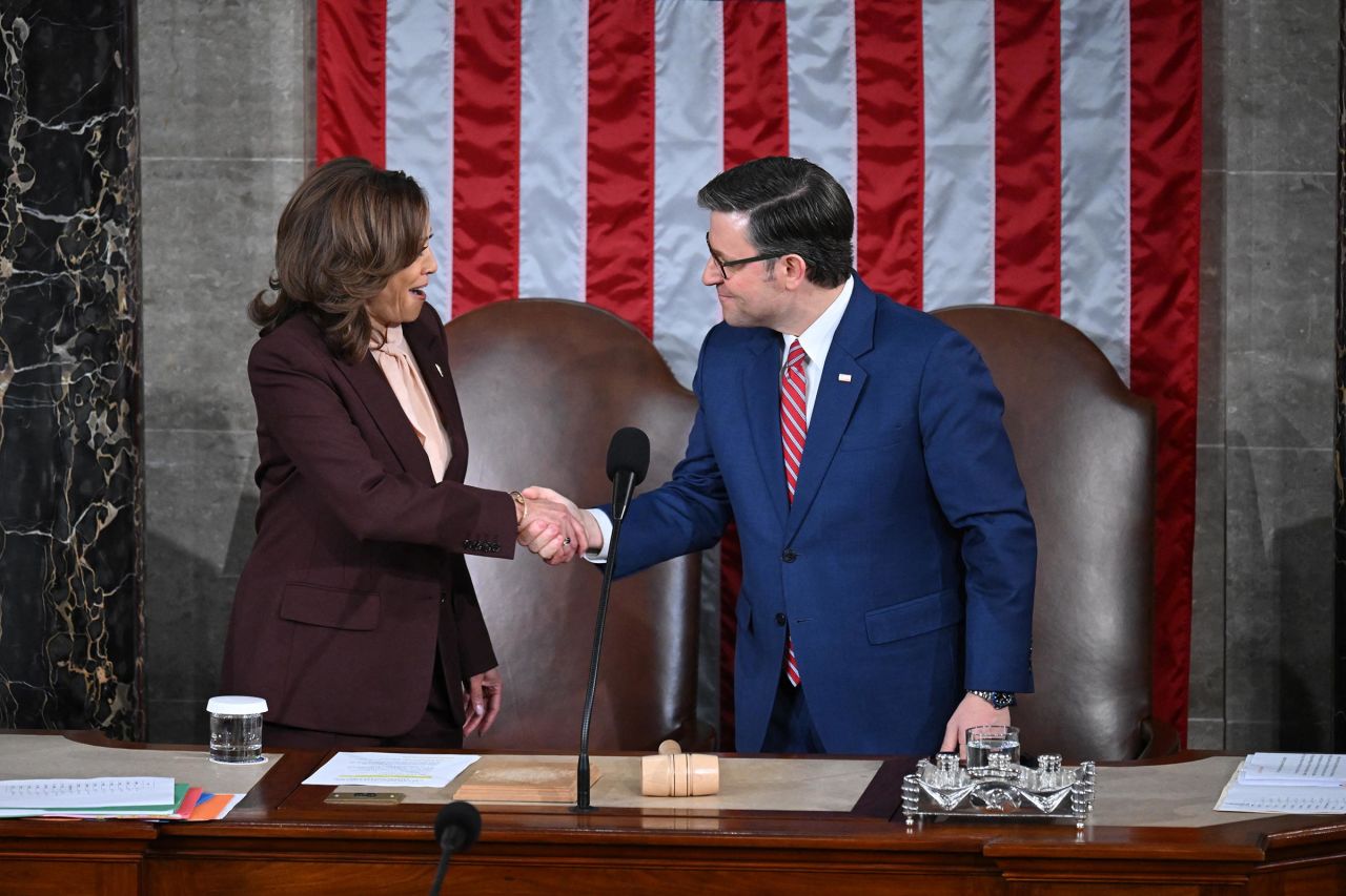 Vice President Kamala Harris shakes hands with House Speaker Mike Johnson as they arrive for a joint session of Congress to certify the results of the 2024 Presidential election, inside the House Chamber at the US Capitol on January 6, in Washington, DC. 