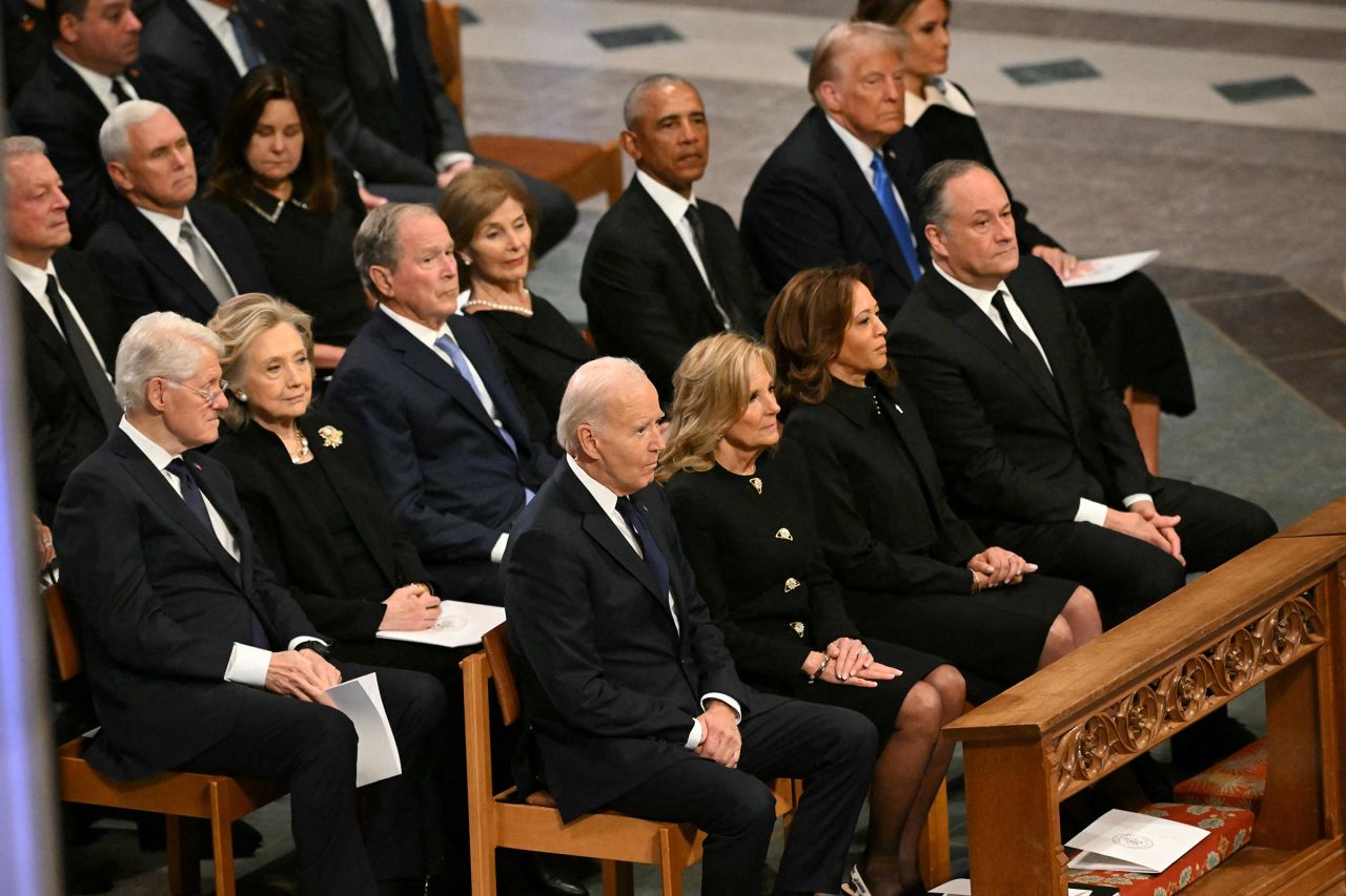 From L to R, front row, US President Joe Biden, First Lady Lady Jill Biden, Vice President Kamla Harris, Second Gentleman Doug Emhoff, second row, former President Bill Clinton, former Secretary of State Hillary Clinton, former President George W. Bush, his wife Laura Bush, former President Barack Obama, President-elect Donald Trump and his wife Melania Trump attend the State Funeral Service for former US President Jimmy Carter at the Washington National Cathedral in Washington, DC, on January 9. 