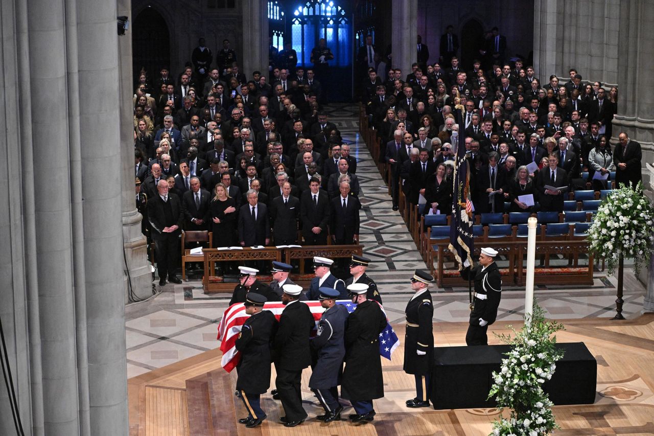 The remains of former President Jimmy Carter are carried by an honor guard on departure from the Washington National Cathedral in Washington, DC, after a State Funeral Service on January 9.