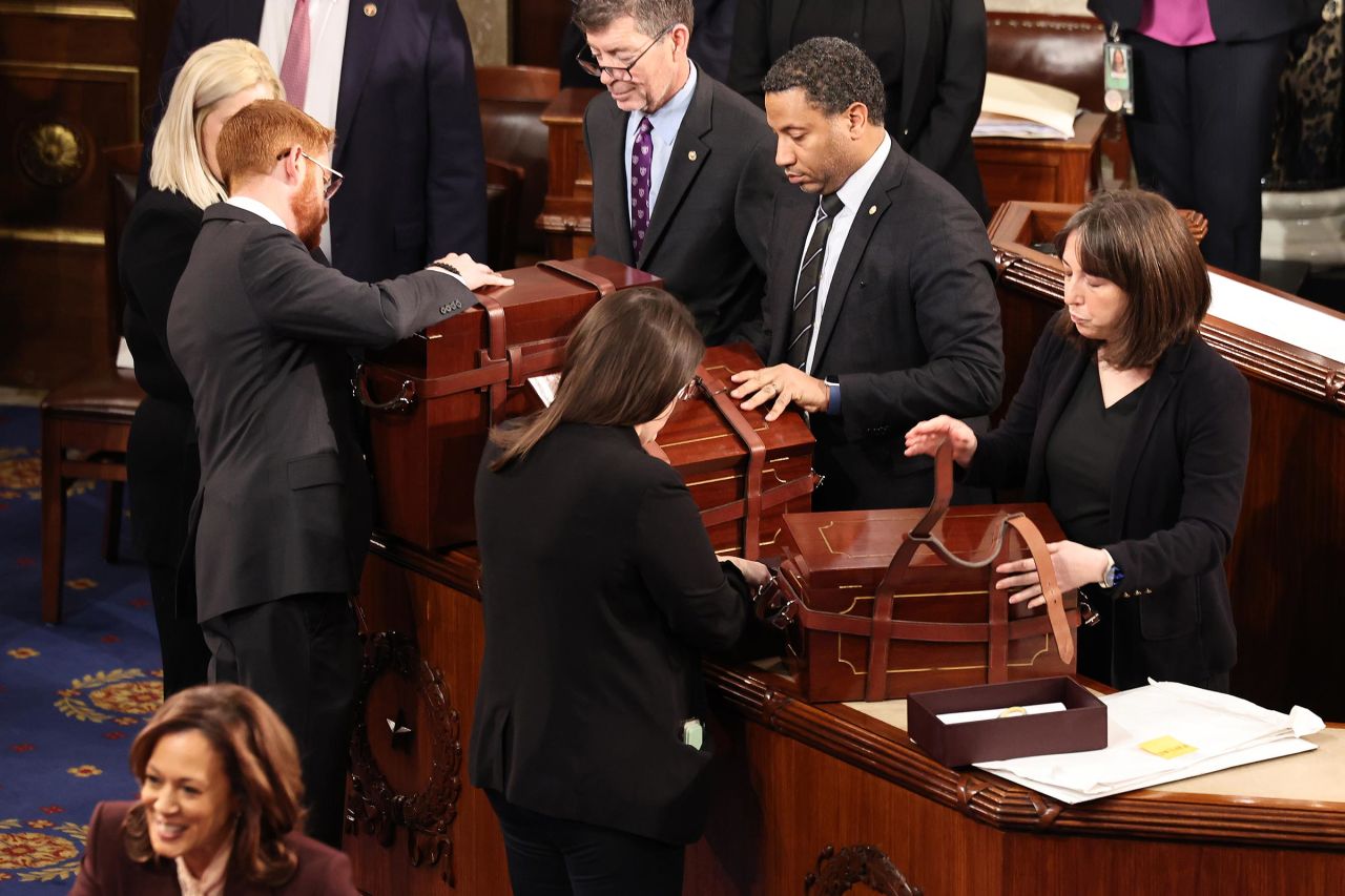 Boxes containing the Electoral College votes are carried into the House Chamber during a joint session of Congress to ratify the 2024 Presidential election at the U.S. Capitol on January 6, in Washington, DC. 