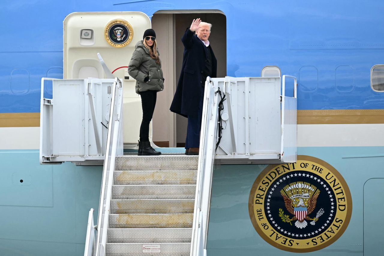 President Donald Trump and First Lady Melania Trump board Air Force One at Asheville Regional Airport in Fletcher, North Carolina, on January 24, 2025, after visiting the region devastated by Hurricane Helene. Trump is headed to California to tour damage caused by the Los Angeles fires. 