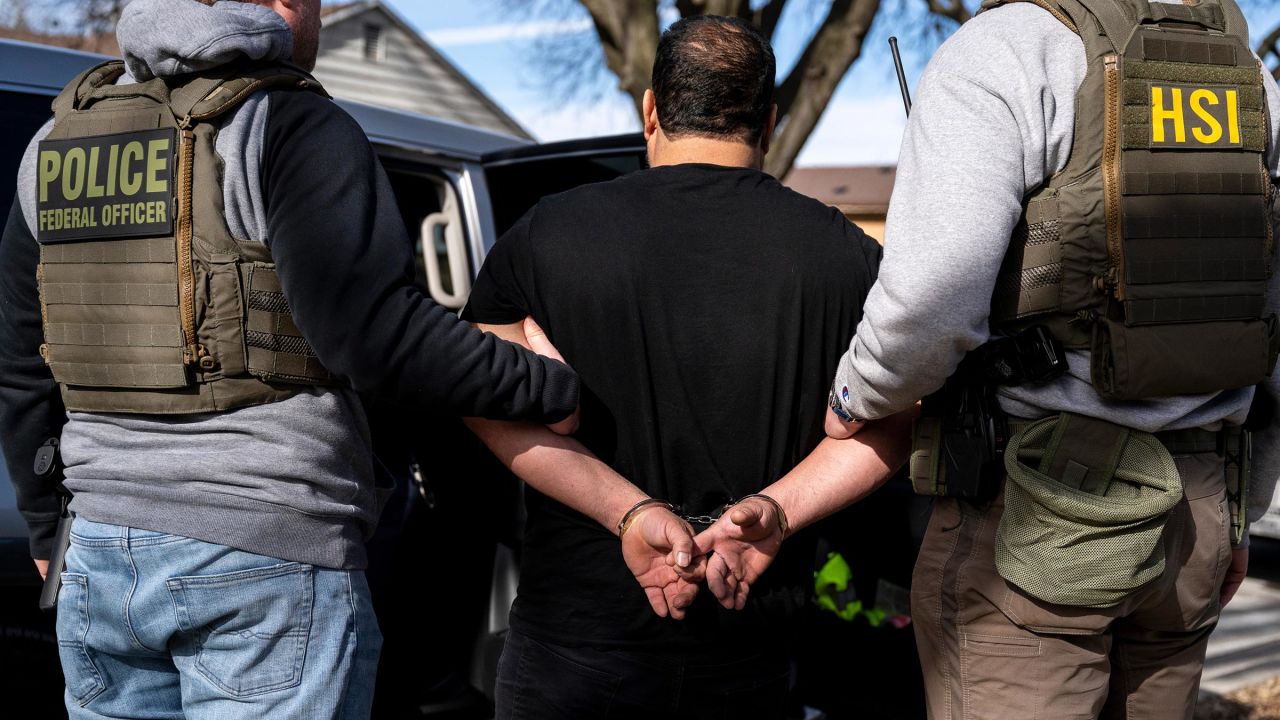 US Immigration and Customs Enforcement agents detain a suspect during a multi-agency targeted enforcement operation in Lyons, Illinois, on January 26. 