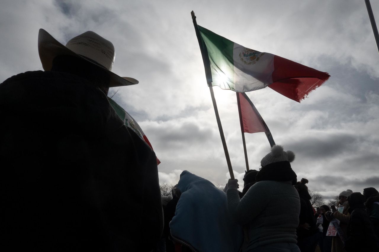 Demonstrators hold a rally and march to protest a recent increase of activity in the area by Immigration and Customs Enforcement agents on February 1, in Waukegan, Illinois. 