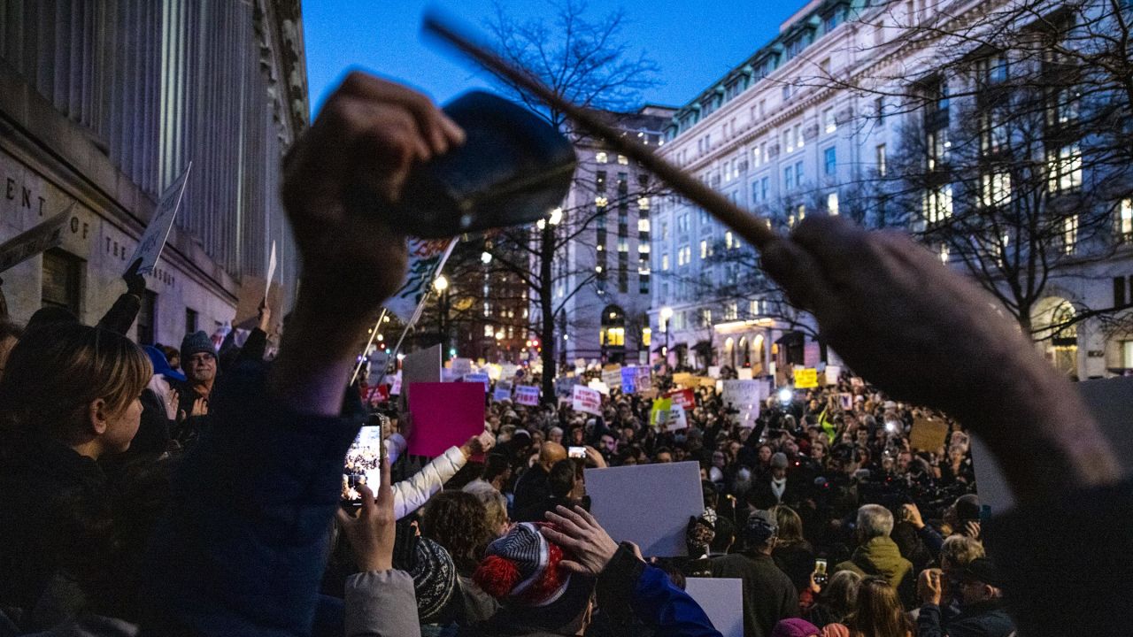 Demonstrators participate in a rally in front of the US Treasury Department in protest of Elon Musk and the Department of Government Efficiency on February 4 in Washington, DC.