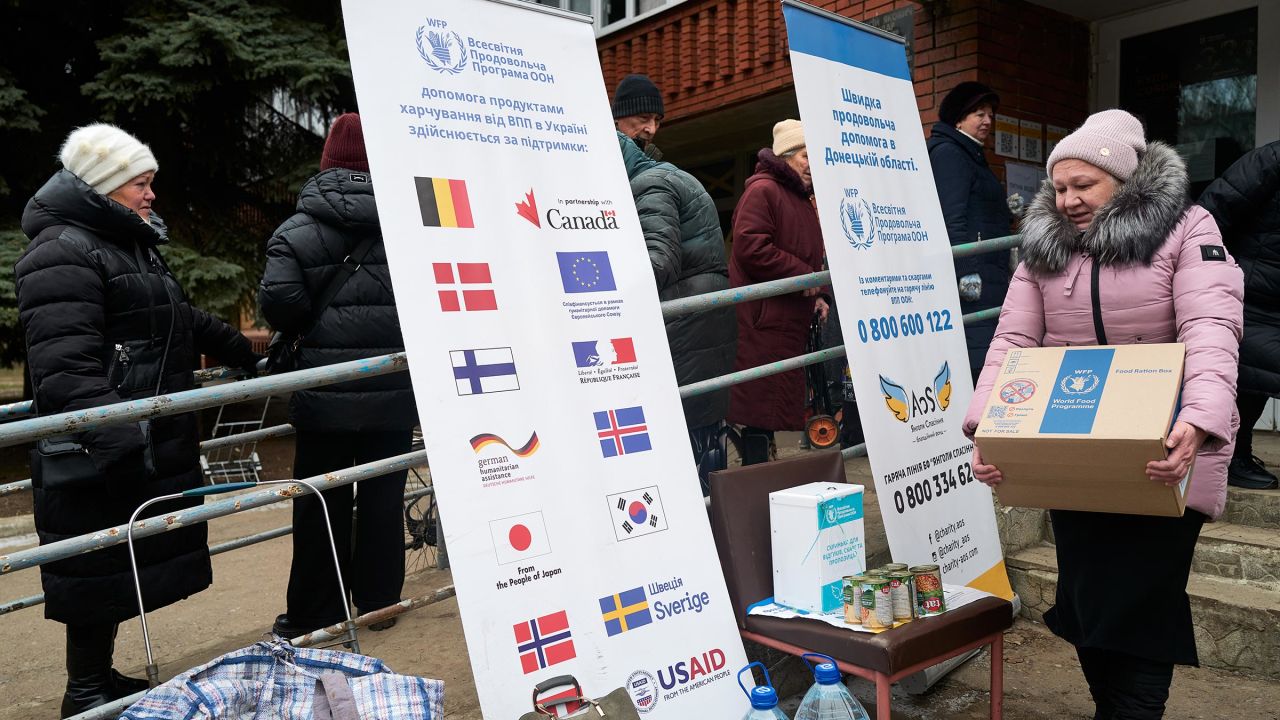 Local residents receive food rations from the World Food Programme, which USAID helps fund, at a food distribution point run by the Ukrainian charity Angels of Salvation on February 7, in Druzhkivka, Ukraine. 