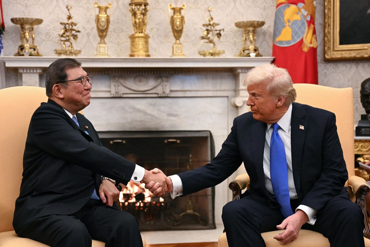 President Donald Trump shakes hands with with Japanese Prime Minister Shigeru Ishiba in the Oval Office of the White House in Washington, DC, on February 7. 