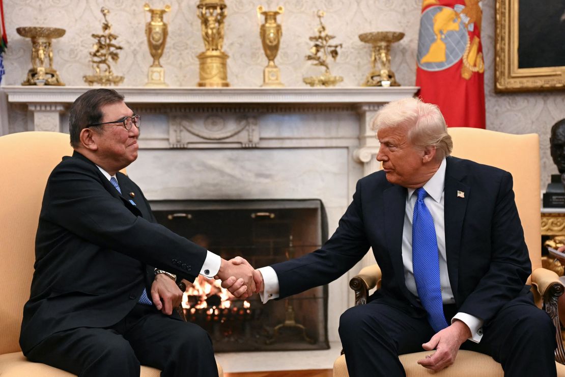 President Donald Trump shakes hands with with Japanese Prime Minister Shigeru Ishiba in the Oval Office of the White House in Washington, DC, on February 7. 