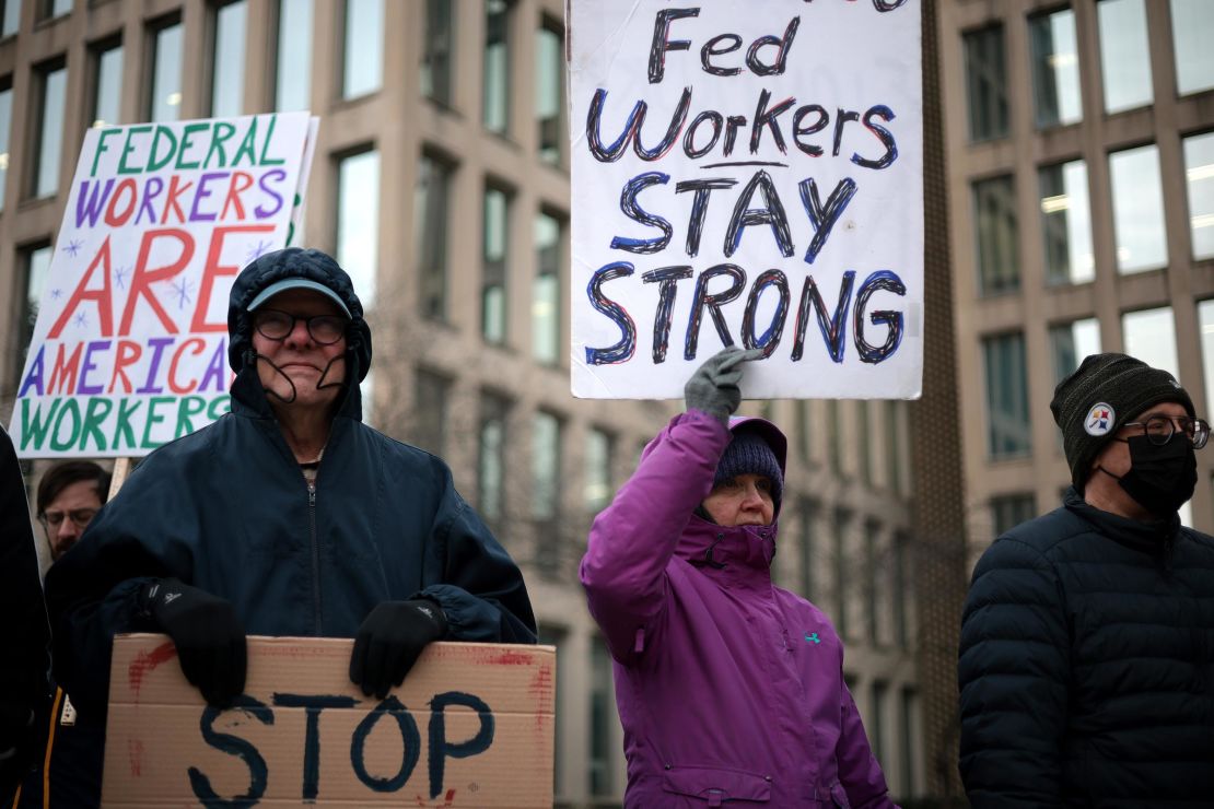 Protesters rally outside of the Theodore Roosevelt Federal Building headquarters of the US Office of Personnel Management on February 5, in Washington, DC.
