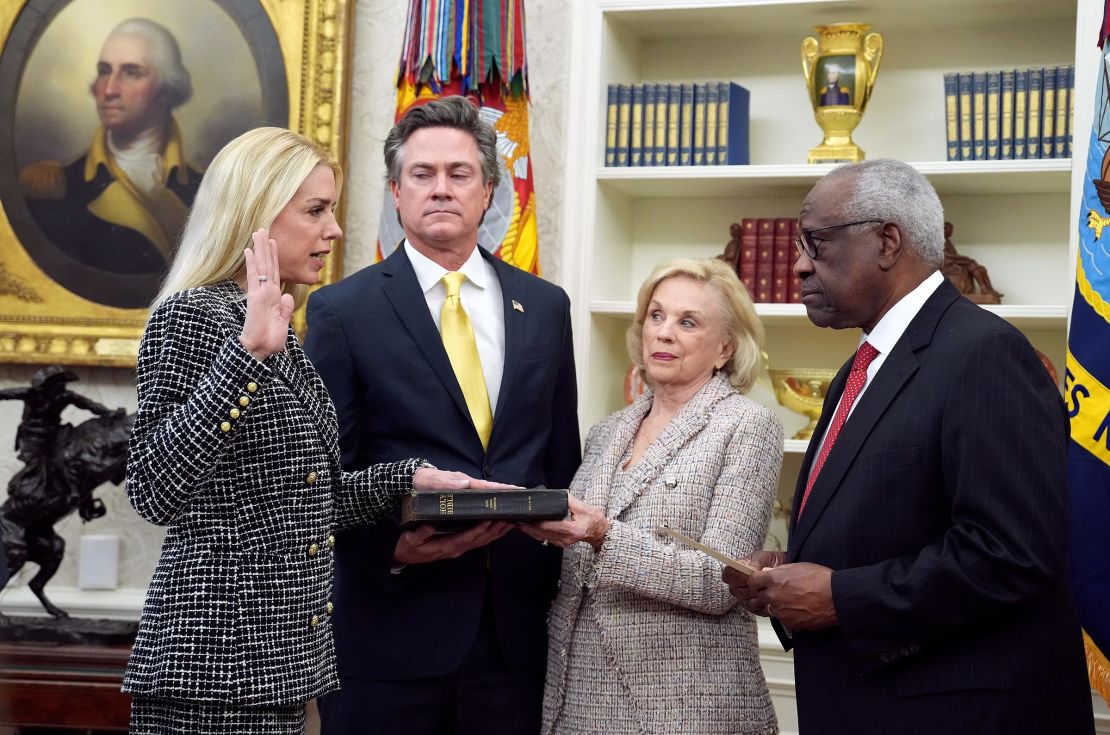 Supreme Court Justice Clarence Thomas swears in Pam Bondi as US Attorney General alongside her partner John Wakefield and mother Patsy Bondi, in the Oval Office at the White House on February 5, in Washington, DC. 