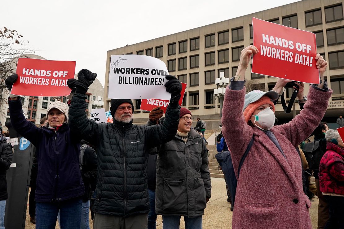 Workers and supporters protest against the Department of Government Efficiency (DOGE) in front of the US Department of Labor on February 5, in Washington, DC. 