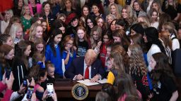 President Donald Trump joined by women athletes signs the “No Men in Women’s Sports” executive order in the East Room at the White House on February 5 in Washington, DC. 
