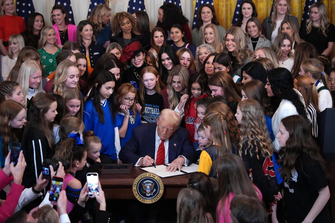 President Donald Trump joined by women athletes signs the “No Men in Women’s Sports” executive order in the East Room at the White House on February 5 in Washington, DC. 