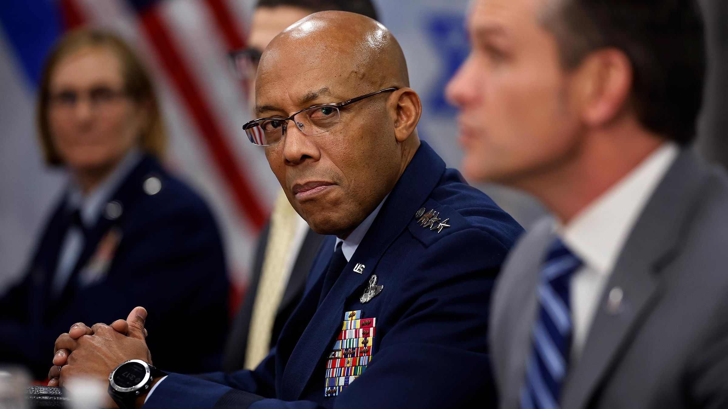 Chairman of the Joint Chiefs of Staff General Charles Brown Jr. listens to Secretary of Defense Pete Hegseth answer reporters' questions before a meeting with Israeli Prime Minister Benjamin Netanyahu to the Pentagon during an honor cordon on February 5, in Arlington, Virginia. 