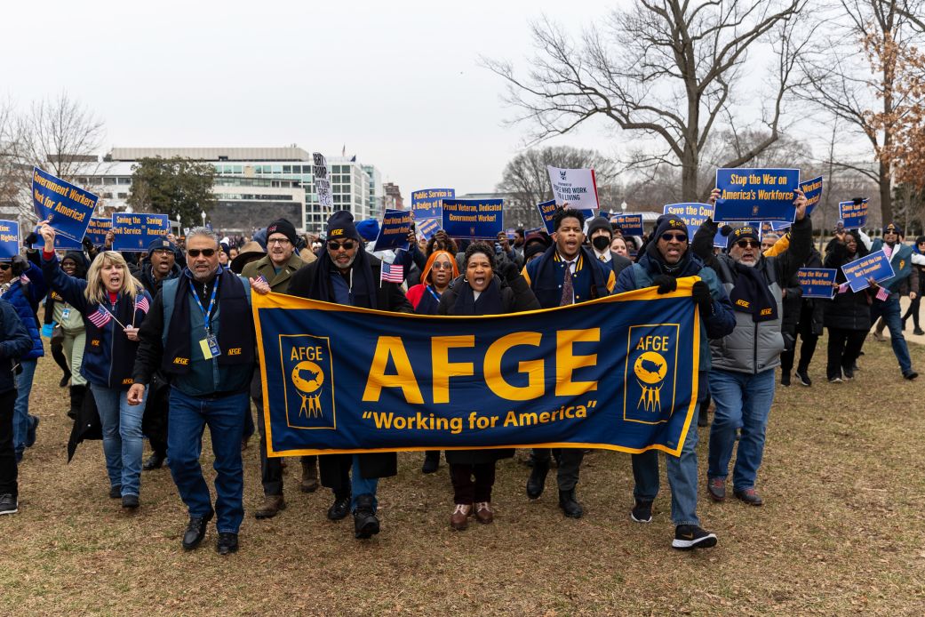Members of the American Federation of Government Employees union protest against firings during a rally to defend federal workers in Washington, DC on February 11.