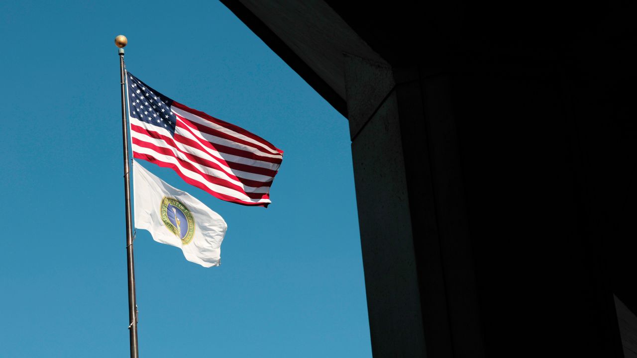 United States and US Department of Energy flags fly near the department's headquarters on February 14, 2025 in Washington, DC.