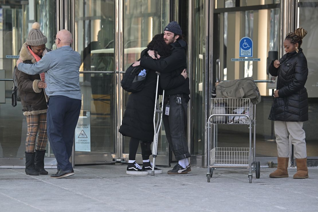 Former Internal Revenue Service workers leave their office after being laid off in downtown Denver, Colorado, on Thursday, February 20.