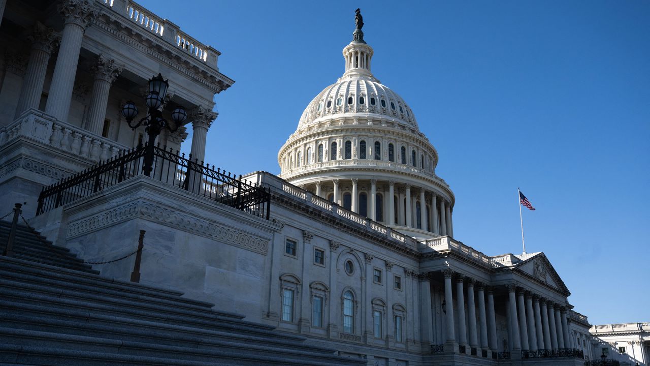 A US flag flies near the dome of the US Capitol in Washington, DC, February 25.